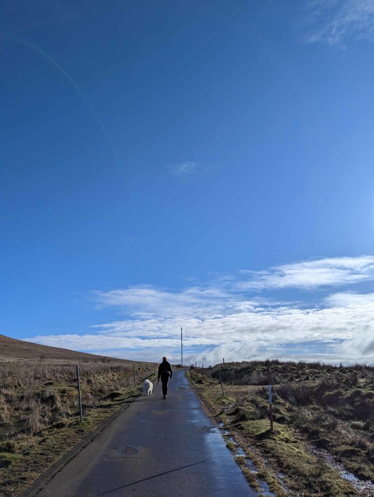 Andrew walking on the Summit Trail on Divis Mountain..