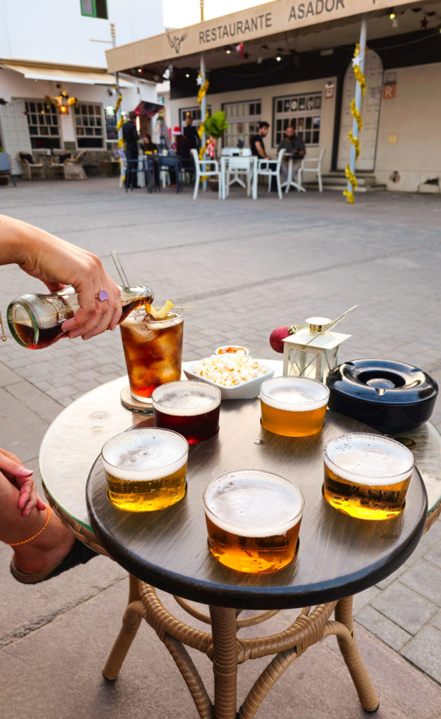 Jane pouring the diet coke into her vodka at Waterfull, Corralejo. Sitting at a table on the street, we also had some beer tastings too.