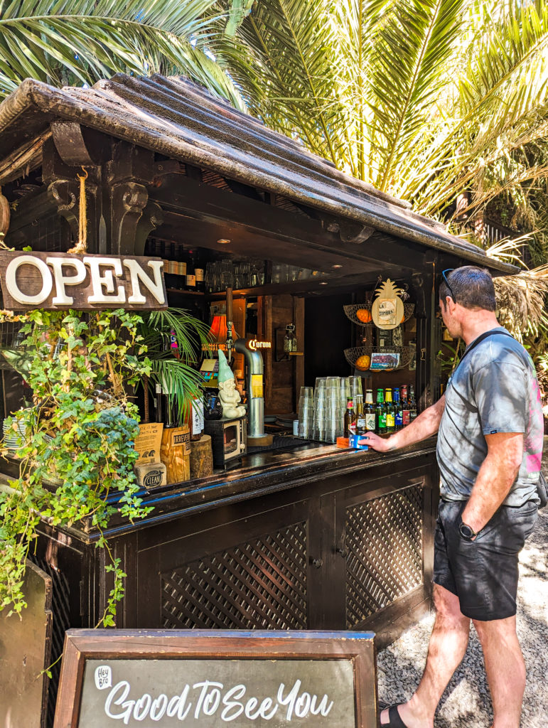 Andrew paying the bill at the beach bar at La Sombra, Betancuria 