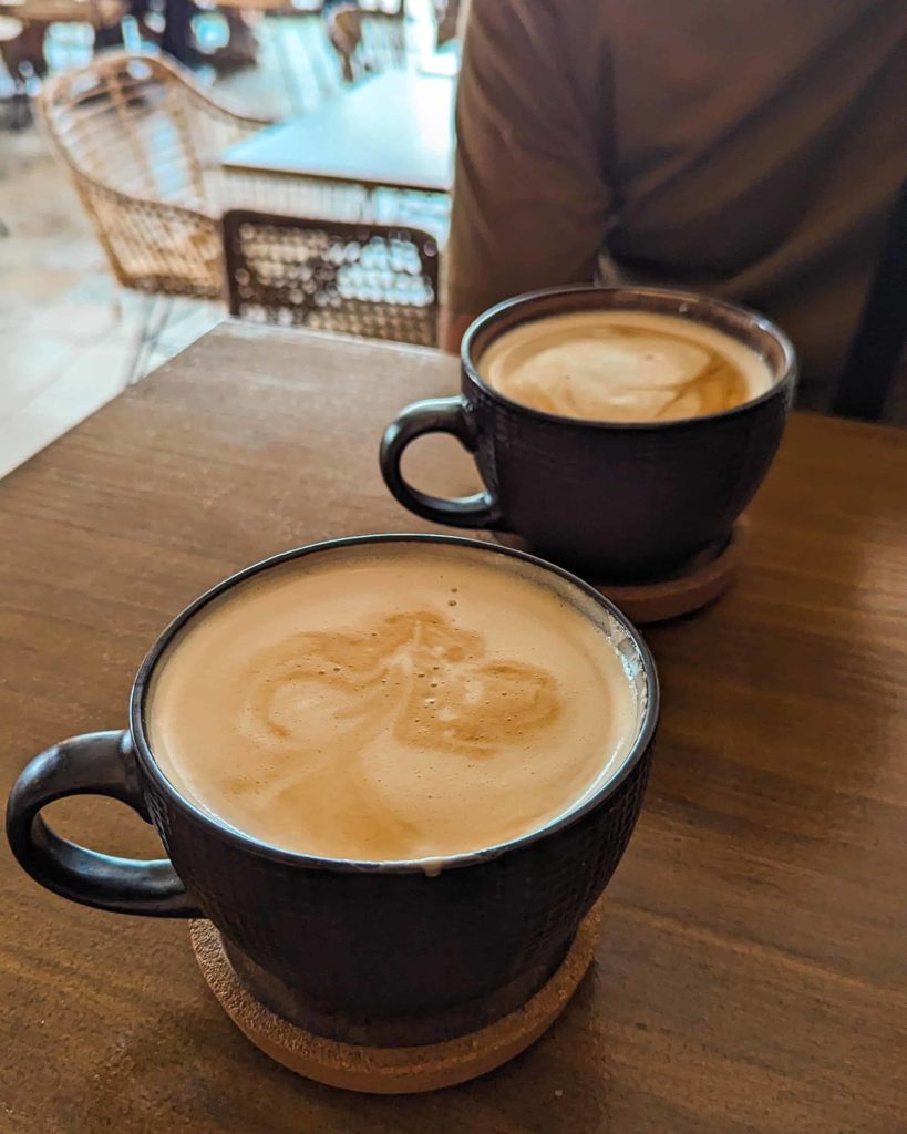 two XL coffees sitting on the table at Almirante Brunch.