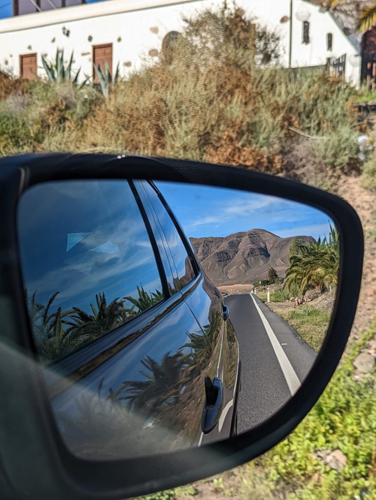 Wing mirror views of one of Fuerteventuras Mountains.