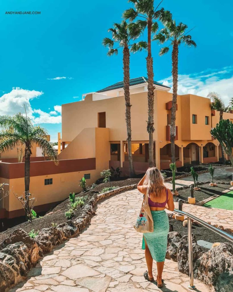 jane walking through the grounds of the hotel