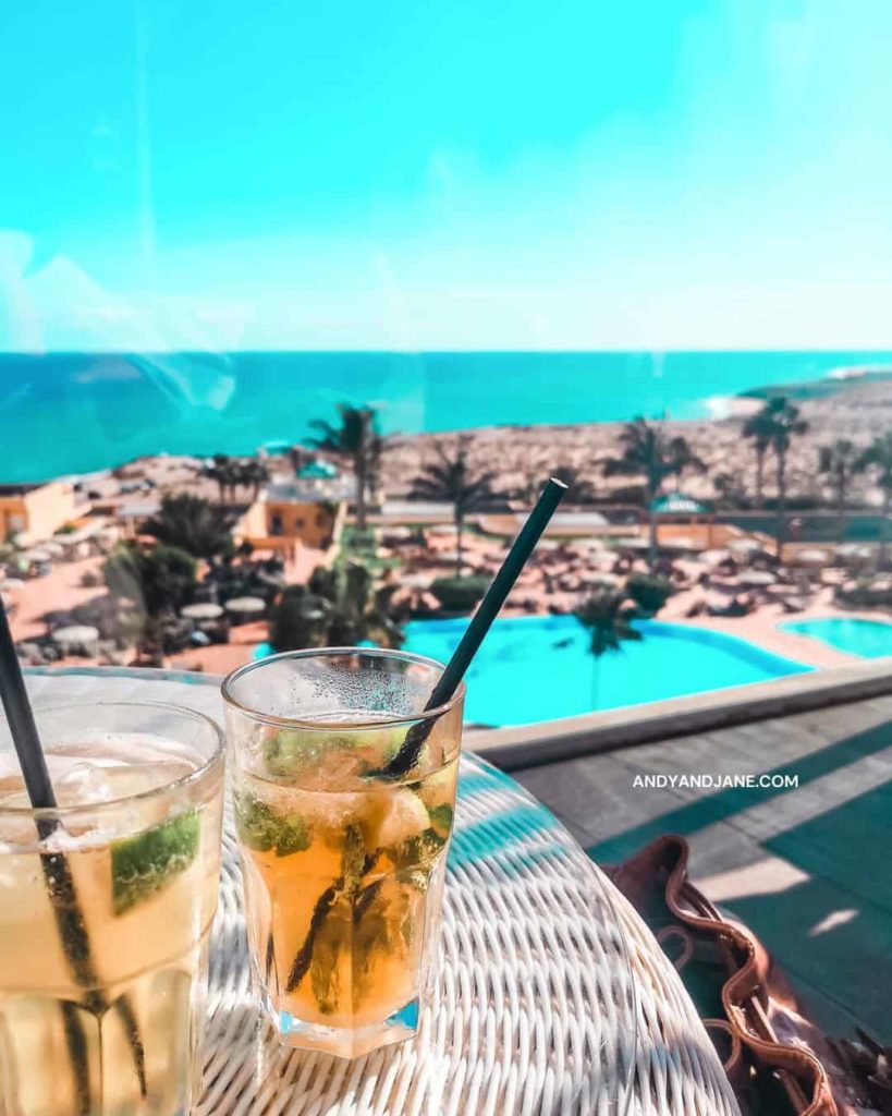 drinks on the outdoor terrace overlooking the pool & sea