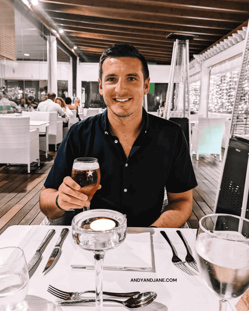 Andrew sipping a beer in the Privilege El Jable Restaurant in H10 Playa Esmeralda.