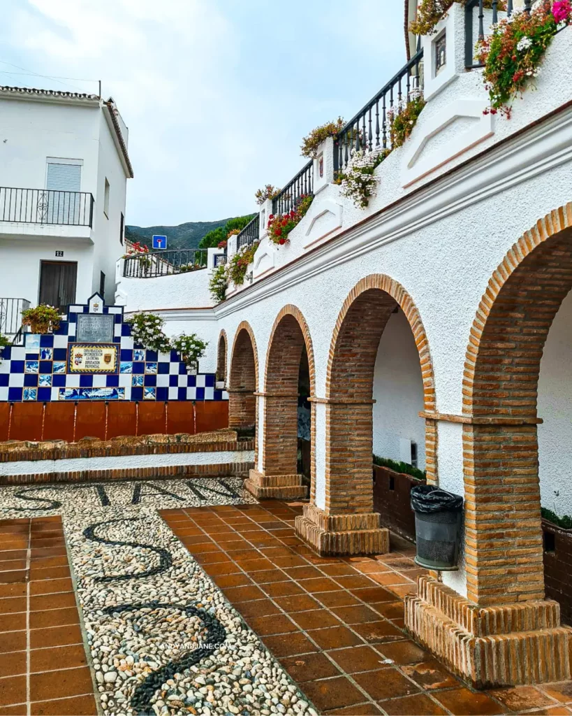 The archways at El Churro Fountain in front of the irrigation ditch.