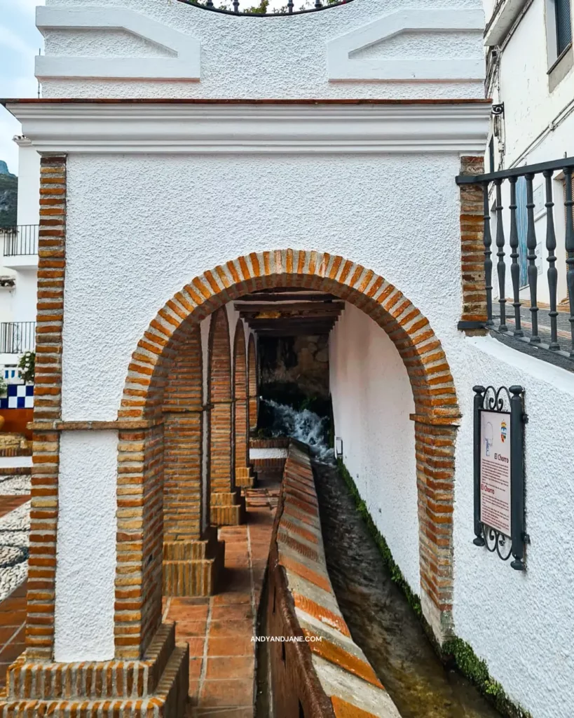 The irrigation ditch at El Churro Fountain in Istan with water flowing through it.