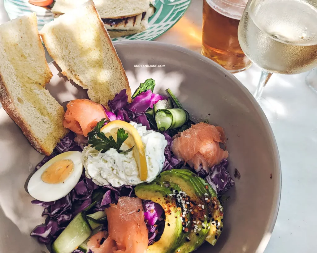 Smoked Salmon & Avocado Bowl at Melia Cafe in Lindos. Contains avocado, smoked salmon, purple cabbage, eggs, rustic bread & green leaves!