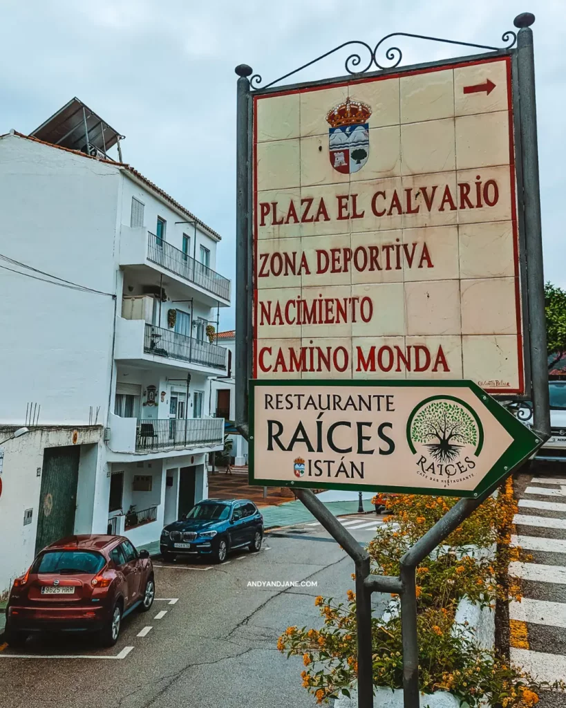 A street sign in Istan showing where to go for parking & hikes.