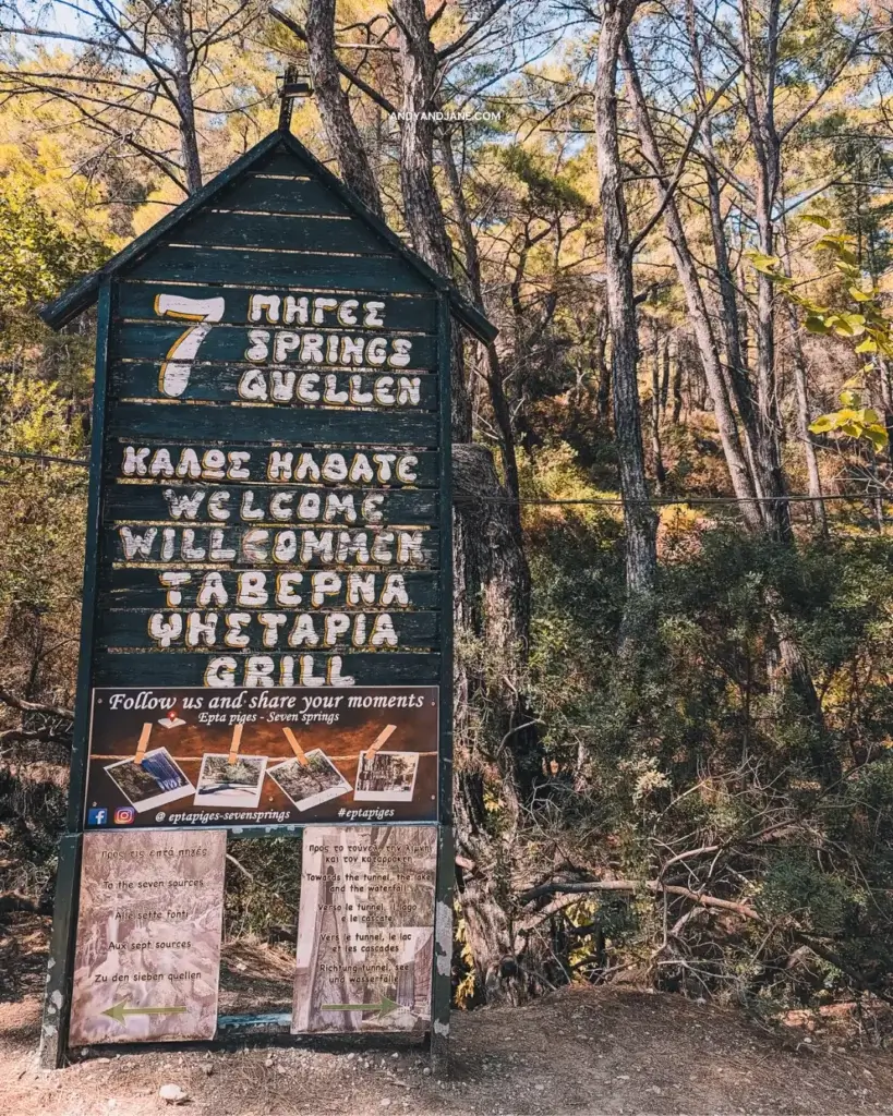 The entrance sign of Seven Springs giving directions to the sights & the tavern.