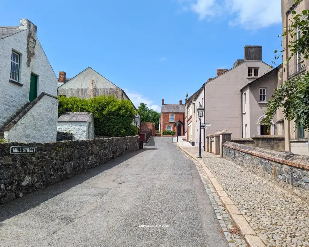 A street with old houses, a church & a pub at the Ulster Folk Museum.