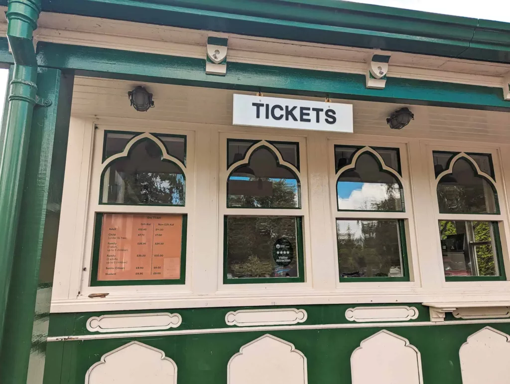 The ticket office at the Ulster Folk Museum showing a sign saying 'Tickets' & a board with prices.