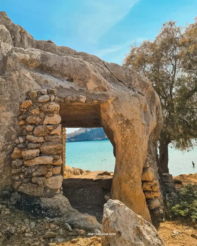 Looking through a the Agia Agatha Cave towards the blue sea and the beach.