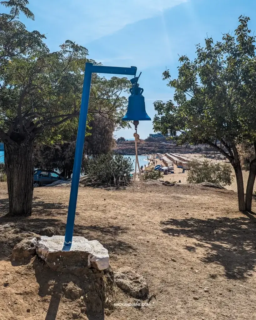 A blue bell overlooking the beach beside the chapel in the rock.