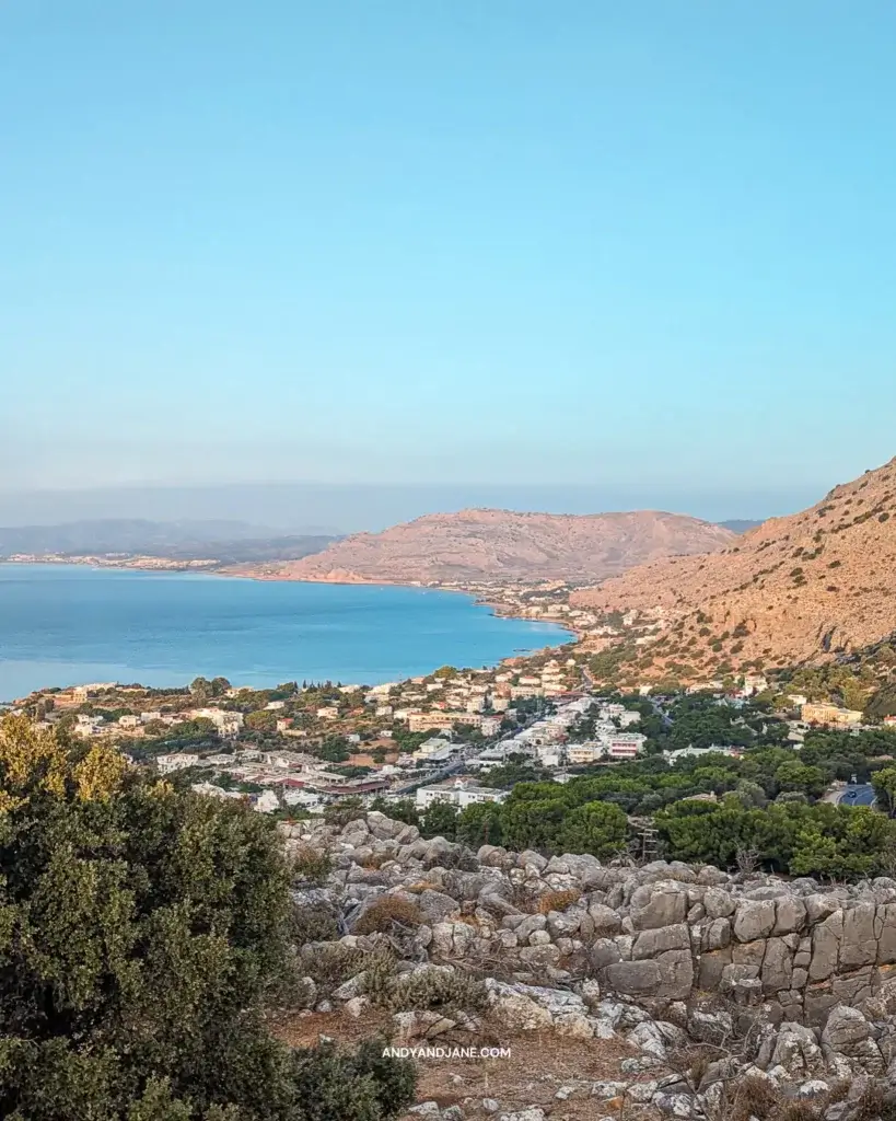 Views across Pefkos Village with the sea & mountains in the distance.