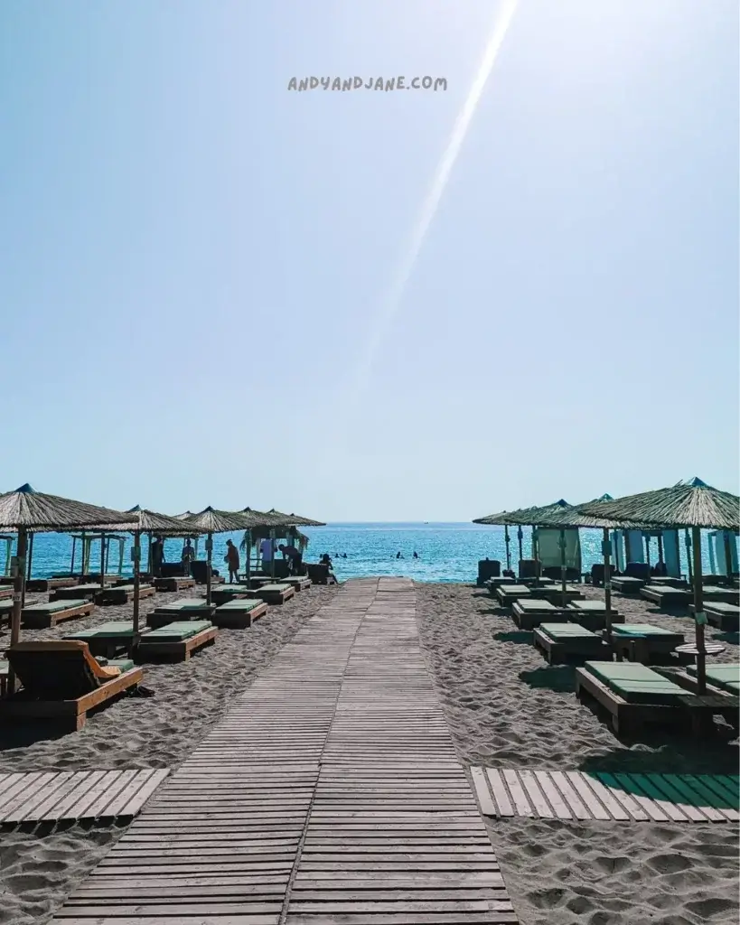 The wooden pathway down to the seafront lined with cabanas at Tsambika Beach.