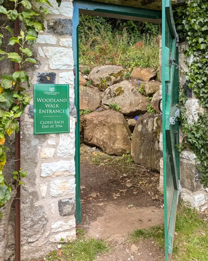 A green door leading to the Woodland Walk trail at Glenarm Castle.